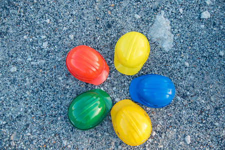Construction hard hat safety tools equipment for workers in construction site for engineering protection head standard. Many hard hat helmet on row with copy space. Engineering Construction Conceptの写真素材