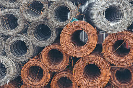 Mesh wire rolls of iron stainless steel, galvanized metal sheets construction material. Chicken wire mesh rolls farm fence. Net wire mesh roll engineer Construction galvanize malleable steel storageの写真素材