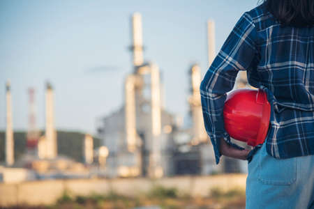 Woman construction engineer wear safety white hard hat at construction site industry worker. Female...