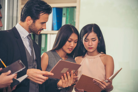 Diversity multiethnic team group of business people Present meeting conference room brainstorming business graph, chart. Multicultural Teamwork collaborate business team meeting together trust partnerの写真素材