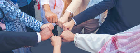 Banner Diverse multiethnic Partners hands together teamwork group of multi racial people meeting join hands togetherness. Panorama Diversity people hands join empower partner team volunteer communityの写真素材