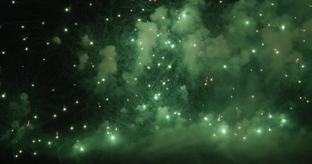 Green Firework celebrate anniversary happy new year 2022, 4th of july holiday festival. Green firework in night time celebrate national holiday. Countdown to new year 2022 festival party time eventの写真素材