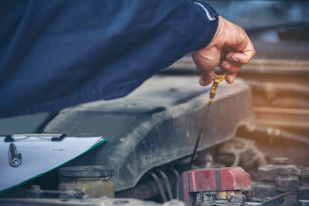Mechanic car service auto garage in automotive mobile center. Technician workshop repair engine...