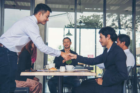 Group of business people meeting in conference room brainstorming consult business document graph chart office desk. Diversity multiethnic group of business people brainstorming and working together.の写真素材