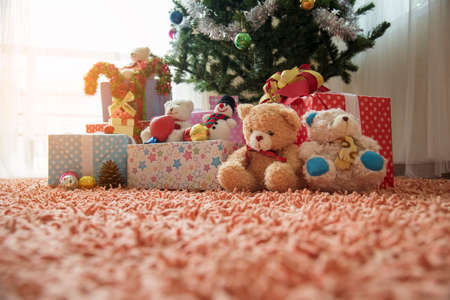 Christmas present gift box under bauble christmas tree decorated holiday winter xmas happy new year celebration. Present gift boxes to family decor in cozy living room. Merry Christmas happy new yearの写真素材