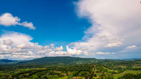 Beautiful landscape mountain green field grass meadow white cloud blue sky on sunny day. Majestic green scenery big mountain hill cloudscape valley panorama view in countryside greenery pastureの写真素材
