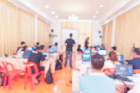 Blur background seminar business event in auditorium  hall convention audience presentation meeting at conference room present screen for entrepreneurs startup business. Blurred background copy spaceの写真素材