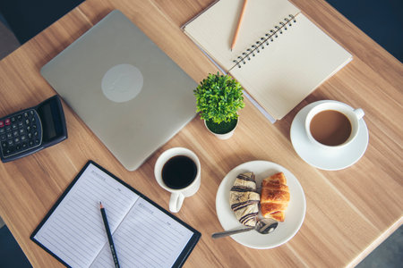 Meeting room Office laptop business financial document chart , graph on wooden table with coffee...