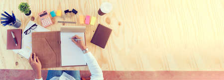 Banner Businesswoman reading financial graph charts business info with computer laptop. Panorama Women hands using laptop on office desk. Hands of business woman working office with copy spaceの写真素材