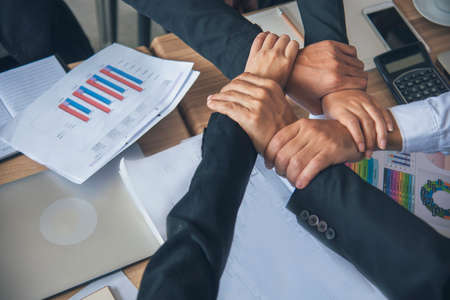 Diverse multiethnic Partners hands together teamwork group of multiracial people meeting join hands togetherness. Diversity people hands join empower partnership teams connection volunteer communityの写真素材