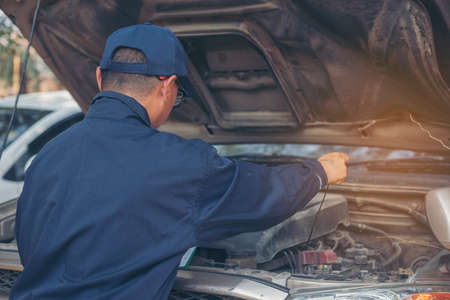 Mechanic car service auto garage in automotive mobile center. Technician workshop repair engine...