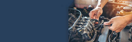 Banner Man hands fixing Car machinery vehicle mechanical service. Mechanic man hands repairing car...