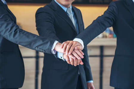 Diversity business partner people teamwork holding hands together power of tag team. Multiethnic Teamwork friendship group brainstorming togetherness. Business people team holding hands Solidarity.の写真素材