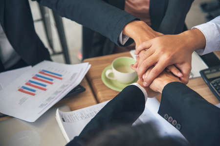 Diverse multiethnic Partners hands together teamwork group of multiracial people meeting join hands togetherness. Diversity people hands join empower partnership teams connection volunteer communityの写真素材