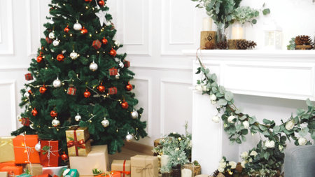 Christmas tree decorated holiday winter xmas celebration present gift to family decor bauble ornament golden ball in cozy living room. Merry Christmas and happy new year festival traditional conceptの写真素材