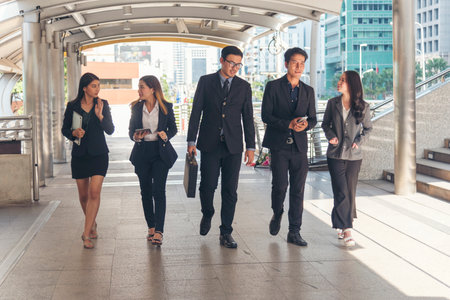 Crowd business people walking go to work in modern city life to working office. Crowd worker group of people busy life with businesswoman,  man in urban street city lifestyle. Business People Concept.の写真素材