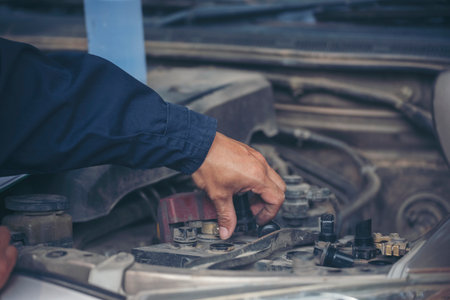 Mechanic car service auto garage in automotive mobile center. Technician workshop repair engine motor vehicles service mechanical engineering business. Automobile mechanic hands car repairs technicの写真素材