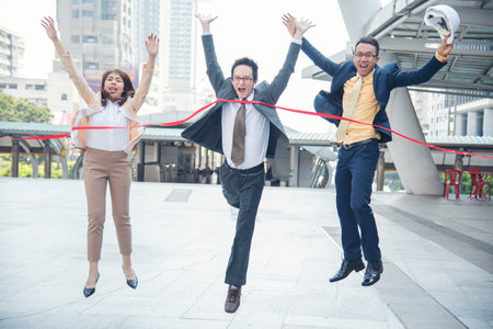 Business competition group of business people in formal suit run to finish line success goal victory strategy. Competitive person race to be first place winner. Multiethnic diversity people contest.の写真素材