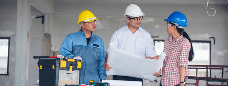 Banner Civil construction engineer team meeting on construction site with partner teamwork trust team consult together. Panorama image engineer team discuss wear hard hat construction engineer conceptの写真素材