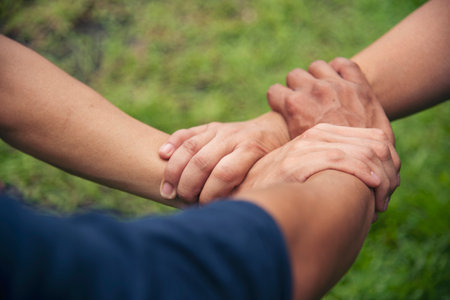 Close up hands Diverse multiethnic Partners team together. Teamwork group of multi racial people meeting join hands. Diversity people hands join empower partnership teams connect volunteer communityの写真素材