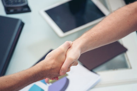 Trust Promise Concept. Honest Lawyer Partner with Professional Team make Law Business Agreement after Complete Deal. Ethics Business people handshake, touch and Respect customer to trust partnership.の写真素材