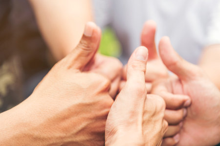 Concept partnership. Group of Photographers  Partners Team with hands together trusted each friends. Hands stacked Holding of business partners.Trust business in authentic of people.の写真素材