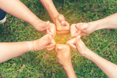 Volunteer Leader effective is key to success. Team Charity group of people giving thump up hands...