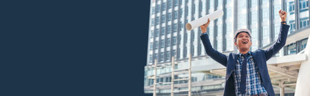 Banner Backside architecture man empowers in success city life. Panorama Victory businessman engineer power holding fist bump blueprint winner positive energy. Businessman engineering with copy spaceの写真素材