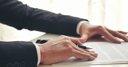 Businessman hand using pen signing on new contract to starting projects in conference room. Close up business manager man hands sign contract legal document in meeting room. Business agreement conceptの写真素材