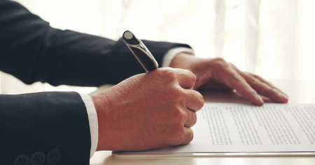 Asian business man using pen signing on new contract to starting projects in conference room. Close up manager businessman hands sign contract working meeting. Business agreement concepts.の写真素材