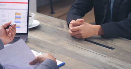 Businessman job interview by human resource HR officer interviwing, talk new employee shaking hands in office with smiling face. HR Manager interview check resume, face to face. Job Interview Conceptの写真素材