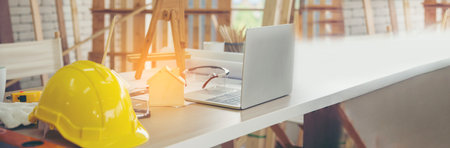 Banner man worker hands holding hardhat yellow work helmet Construction Engineer. Panorama Refinery man worker industry hand hold yellow worker helmet hard hat. Refinery industry with copy spaceの写真素材