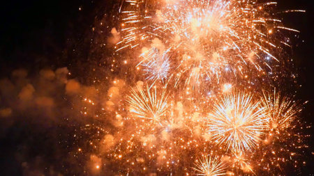 Golden Firework celebrate anniversary happy new year 2023, 4th of july holiday festival. Gold firework in the night time celebrate national holiday. Countdown to new year 2023 gold party time eventの写真素材