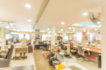 Business office Blurred background meeting room light bokeh education event in company. Blurry abstract background of conference room. Blur background office modern lobby urban decor empty roomの写真素材