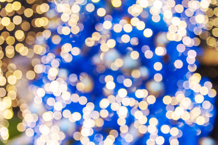 Blurred background golden glitter shiny sparkling banner. Happy Holidays background for template on christmas card brochures posters. Gold bokeh template for digital presentation slideshow backgroundの写真素材
