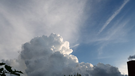 Dark rain cloud dramatic sky summer tropical thunder storm sky and fluffy black darkness cloud nearly raining cloudscape. Nimbus raincloud skyline climate background. Dark gray sky cloudy environmentの写真素材