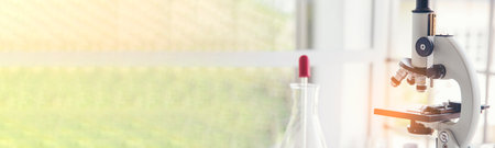 Banner Science chemistry glass tubes object on lab background. Wide Liquid tube biology laboratory chemical fluid scientist object medical glass tubes. Chemistry scientific background with Copy Spaceの写真素材