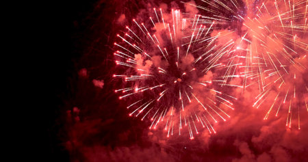 Red Firework celebrate anniversary happy new year 2023, 4th of july holiday festival. red firework in night time celebrate national holiday. Countdown to new year 2023 festival party time eventの写真素材