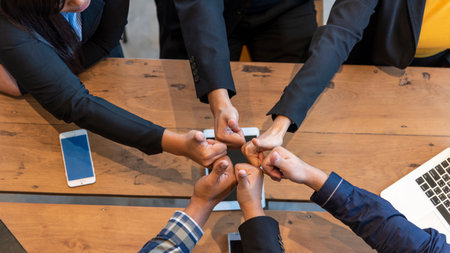 Thumbs up team hand satisfaction job with positive happy good sign. Close up business people partner hand Positive idea good sign. Teams trust Gesture sign Thumbs up together as teamwork partnershipの写真素材