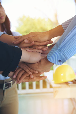 Diverse multiethnic Partners hands together teamwork group of multiracial people meeting join hands...