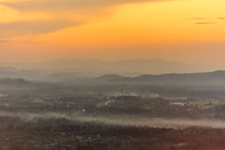 Sunset mountain range beautiful landscape mist, dusk golden time dramatic sky. Beautiful landscape high mountain ridge mist panning panorama scenery dawn dramatic sky. Sunrise landscape mountain peak.の写真素材
