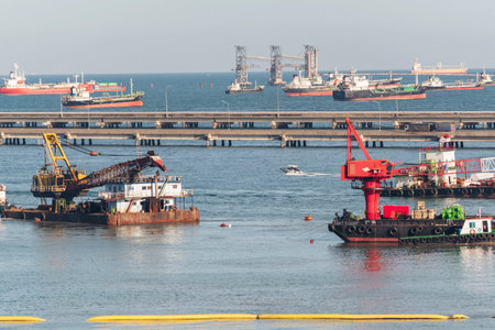 Engineering shipping crane depot at logistic export terminal control. Warehouse freight background container yard loading quayside harbor port. Logistics seascape shipping portal conceptの写真素材