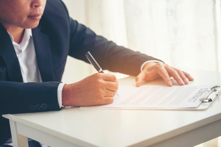 Asian business man using pen signing on new contract to starting projects in conference room. Close up manager businessman hands sign contract working meeting. Business agreement concepts.の写真素材