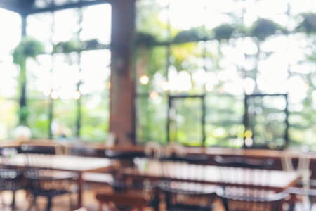 Blurred background cafe coffee shop restaurant in shopping mall with light bokeh business event...