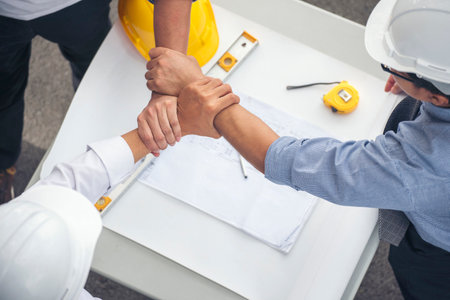 Group of multiracial people Teamwork meeting join hands Engineer Manager Foreman fist bump together....