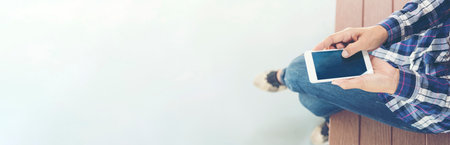 Banner woman hands using smartphone digital technology tablet. Hands women holding smart tablet touch screen shopping online, call, message. Close up woman using mobile at home office with copy spaceの写真素材