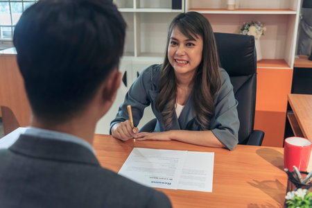 Job Interview with headhunter agent and applicant. Job HR applicants having an interview with Human resource manager jobs interviewing with confident candidate at business firm office give cv resumeの写真素材