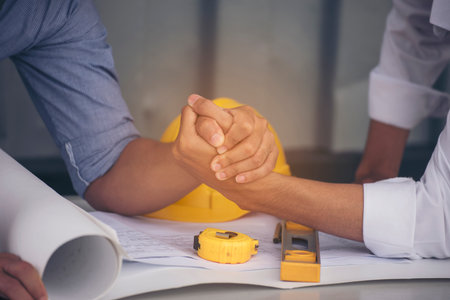 Group of multiracial people Teamwork meeting join hands Engineer Manager Foreman fist bump together....