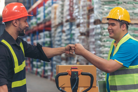 Teamwork Warehouse worker shakehand together. Engineer man hands partnership. Diversity Coworker Men...
