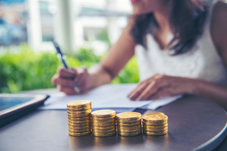 Finance Plan coin stack hands protect Debt loan Home financial plan coin stack concept. Investment plan stack gold money wealth bank. Financial advice planning budget investment insurance conceptの写真素材